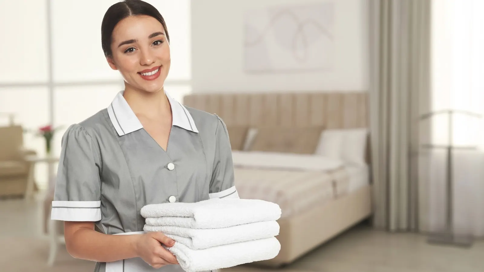 Housekeeping attendant with towels in Chicago IL